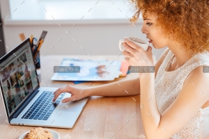 demo-attachment-218-woman-photographer-drinking-coffee-and-working-PJNBP6U@2x